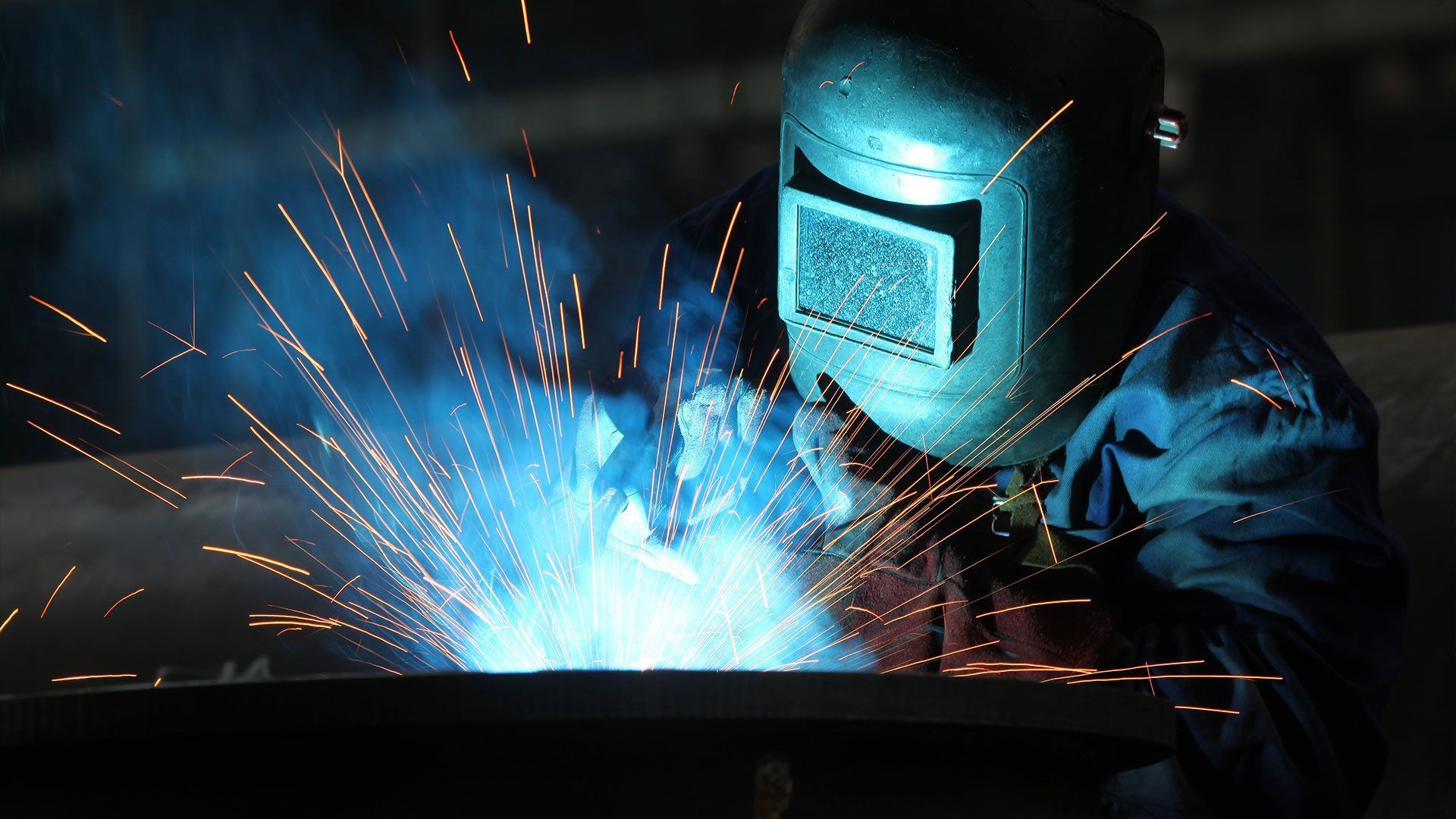 Man With Welding Helmet Welding Steel