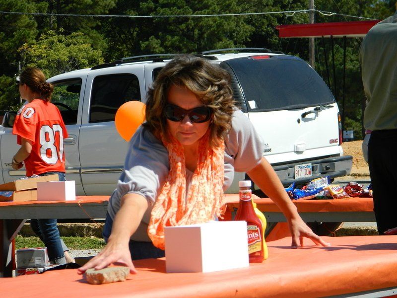 A woman wearing sunglasses and a jersey with the number 87 on it