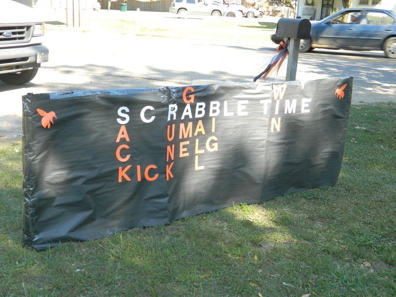A sign that says scrabble time on it