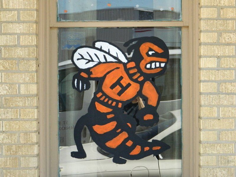 A drawing of a bee with the letter h on its chest