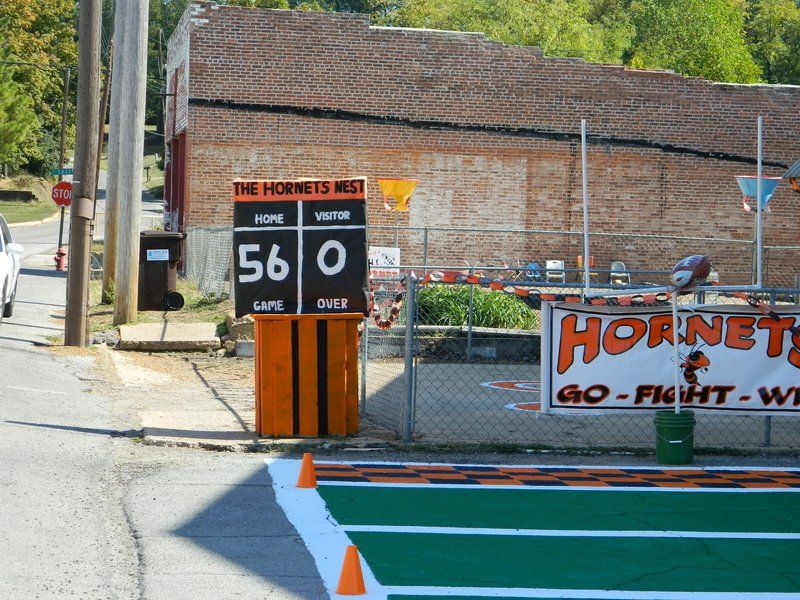 A scoreboard with hornets go fight win written on it