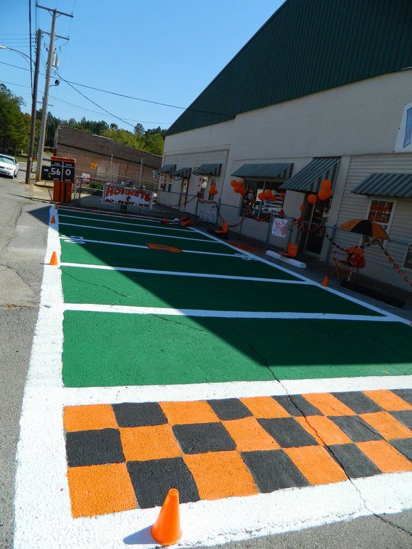 A parking lot has a checkered pattern painted on it