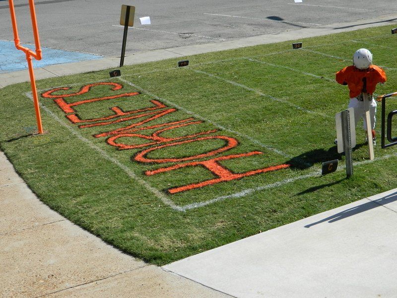 A football field with the word home painted on it