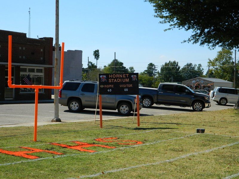 A football field with a sign that says hornet stadium on it