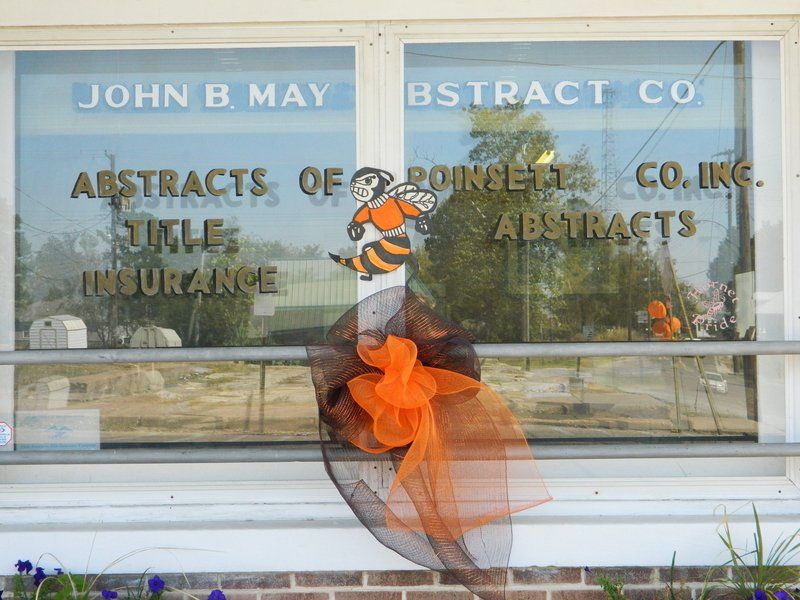 A window with the name john b may on it