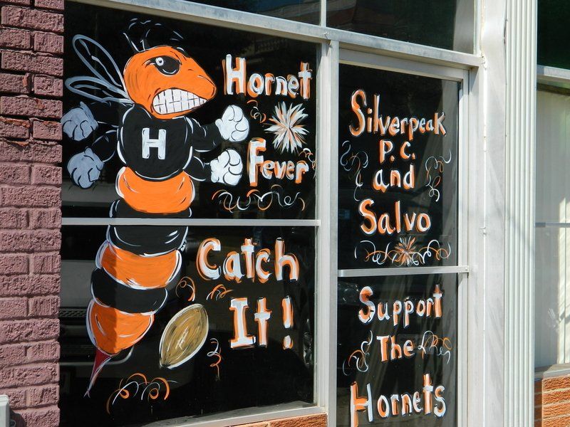 A store front with a sign that says catch it
