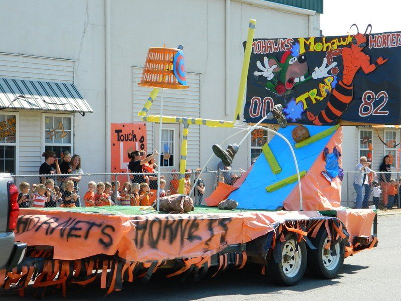 A float in a parade has the number 82 on it