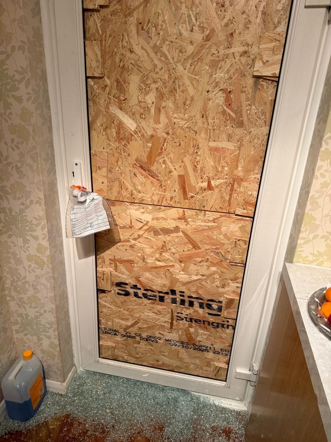 upvc door boarded up in Orpington following a burglary