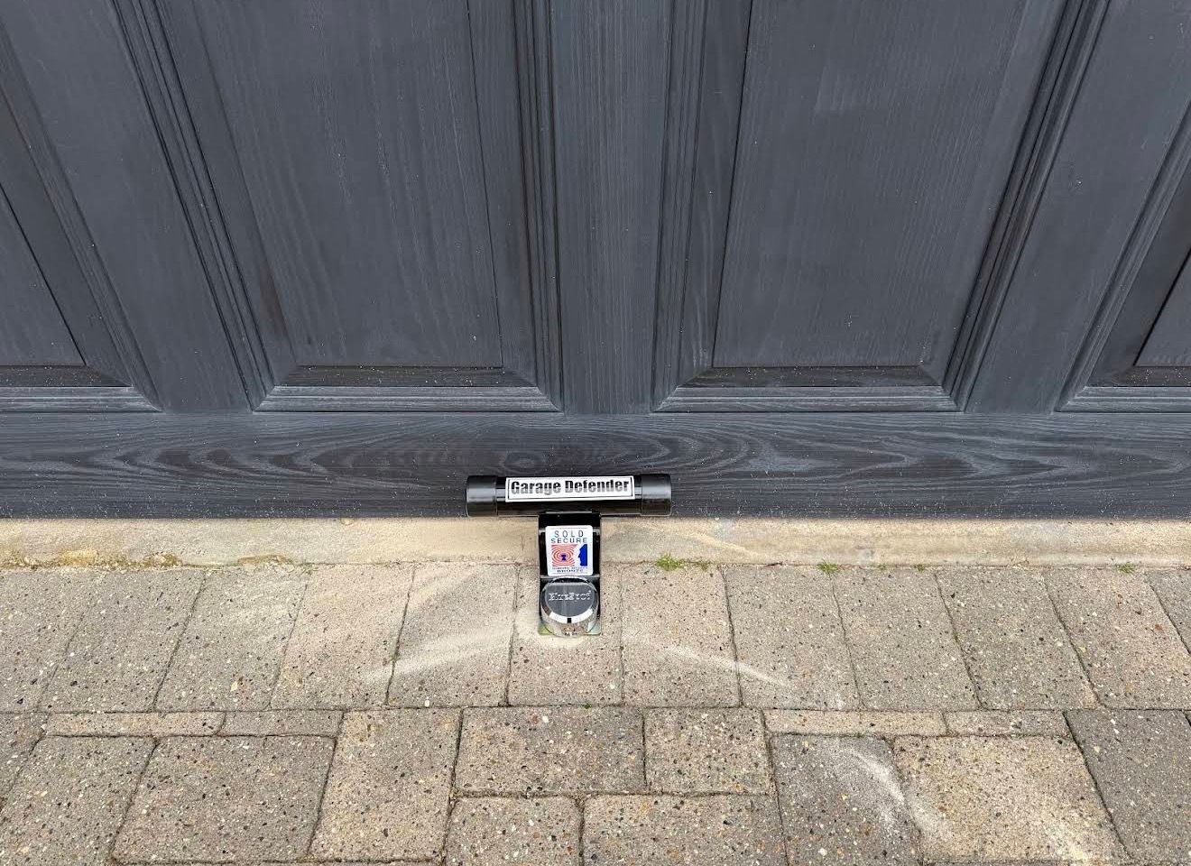 Garage lock replacement on an up-and-over garage door by The Key Locksmith for improved garage security in Orpington and Bromley.