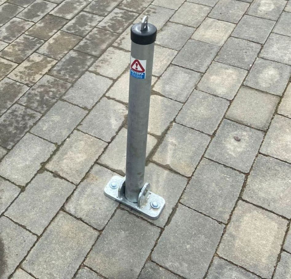 Heavy-duty Autopa fold-down parking post professionally installed on a London driveway by The Key Locksmith to help secure a private parking space and improve driveway security.