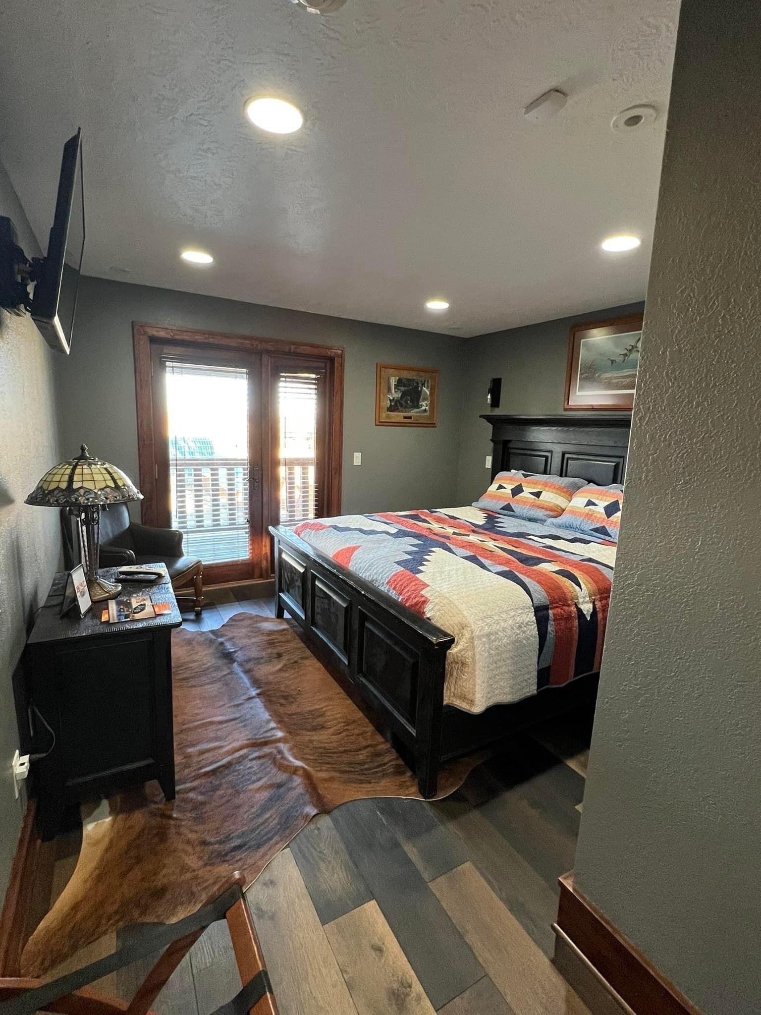 There is a large bed in the middle of the room.