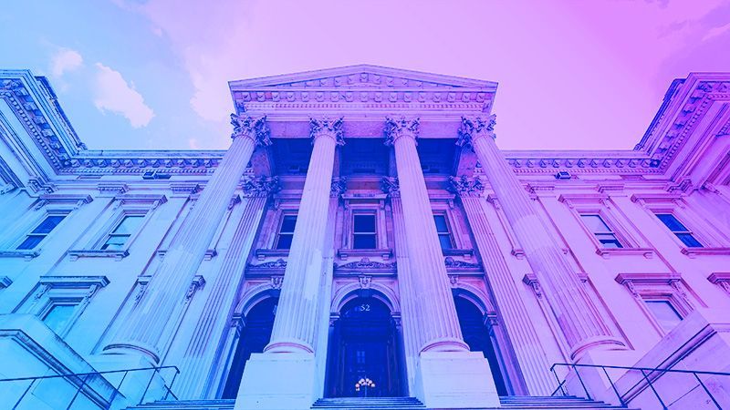 Statue of justice with neon overlay.