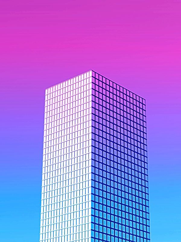 Purple to blue neon sky with a simple skyscraper with grid-like windows in foreground