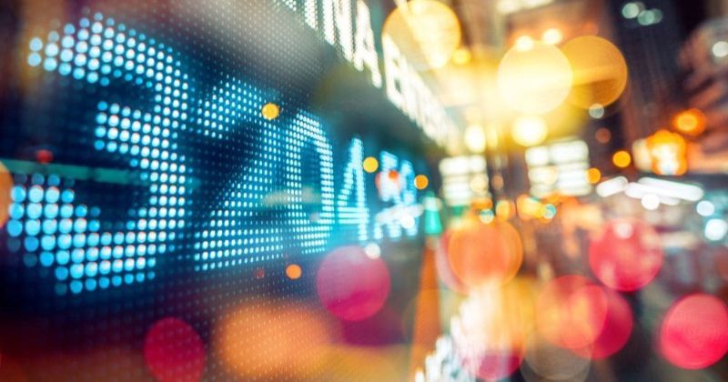 Neon numbers on a screen.