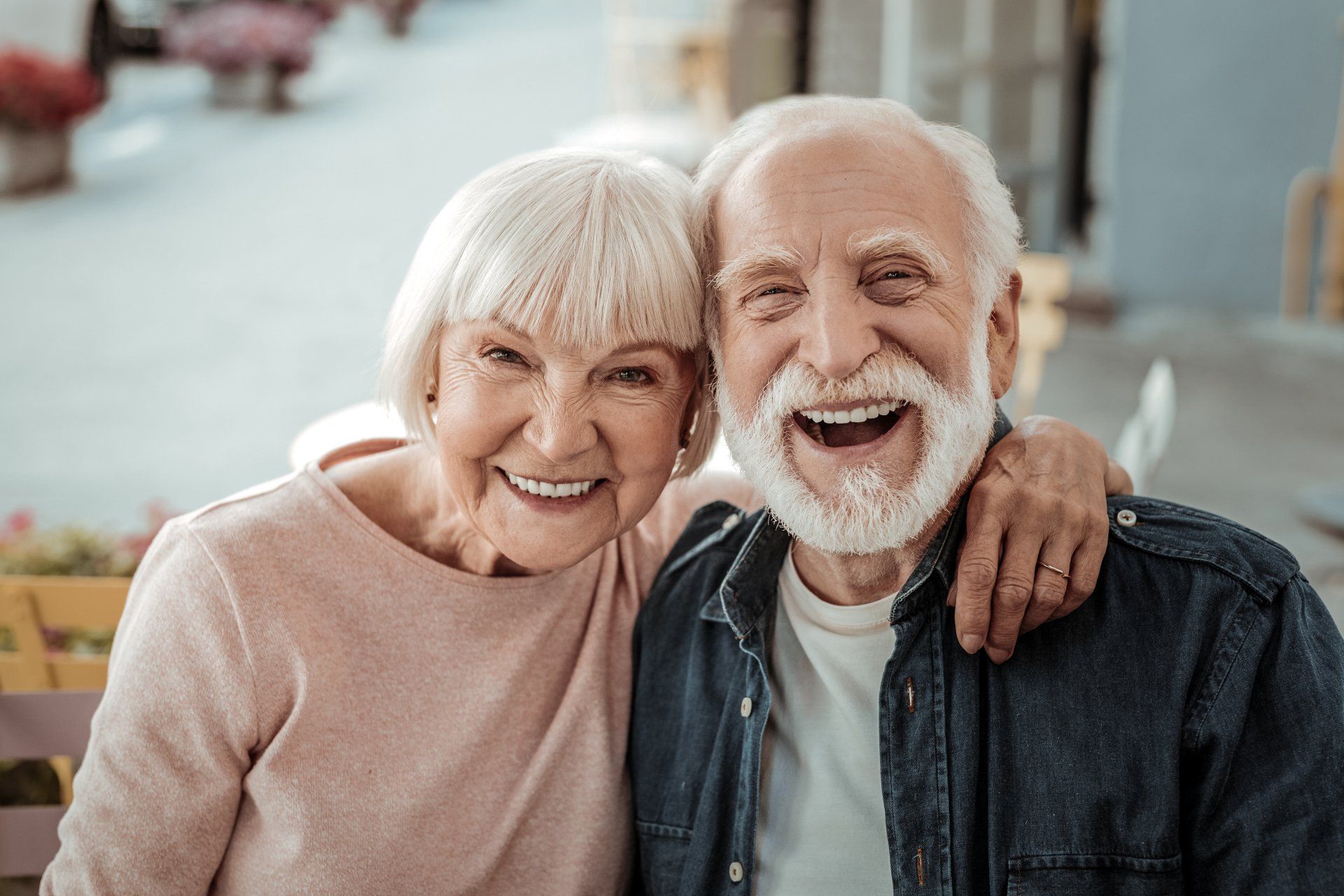 a man and a woman are posing for a picture and smiling.