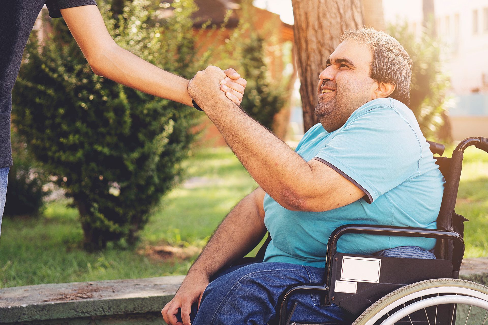 man holding hand of his peer
