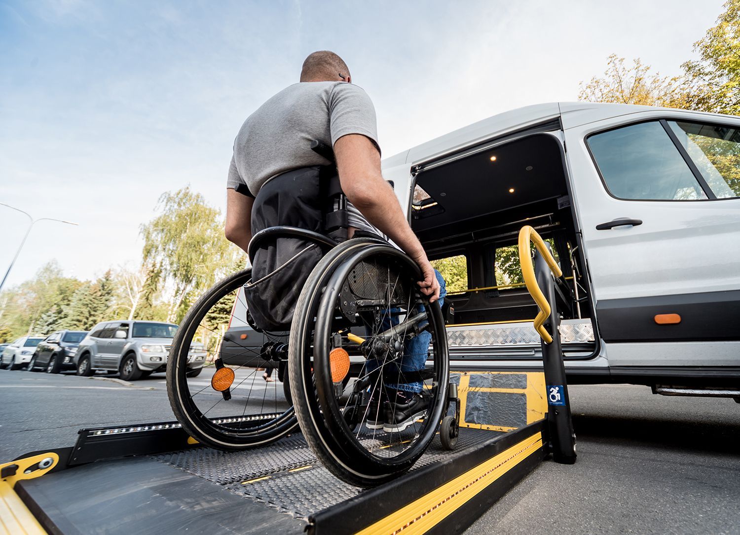 a man going inside a wheelchair-accessible van