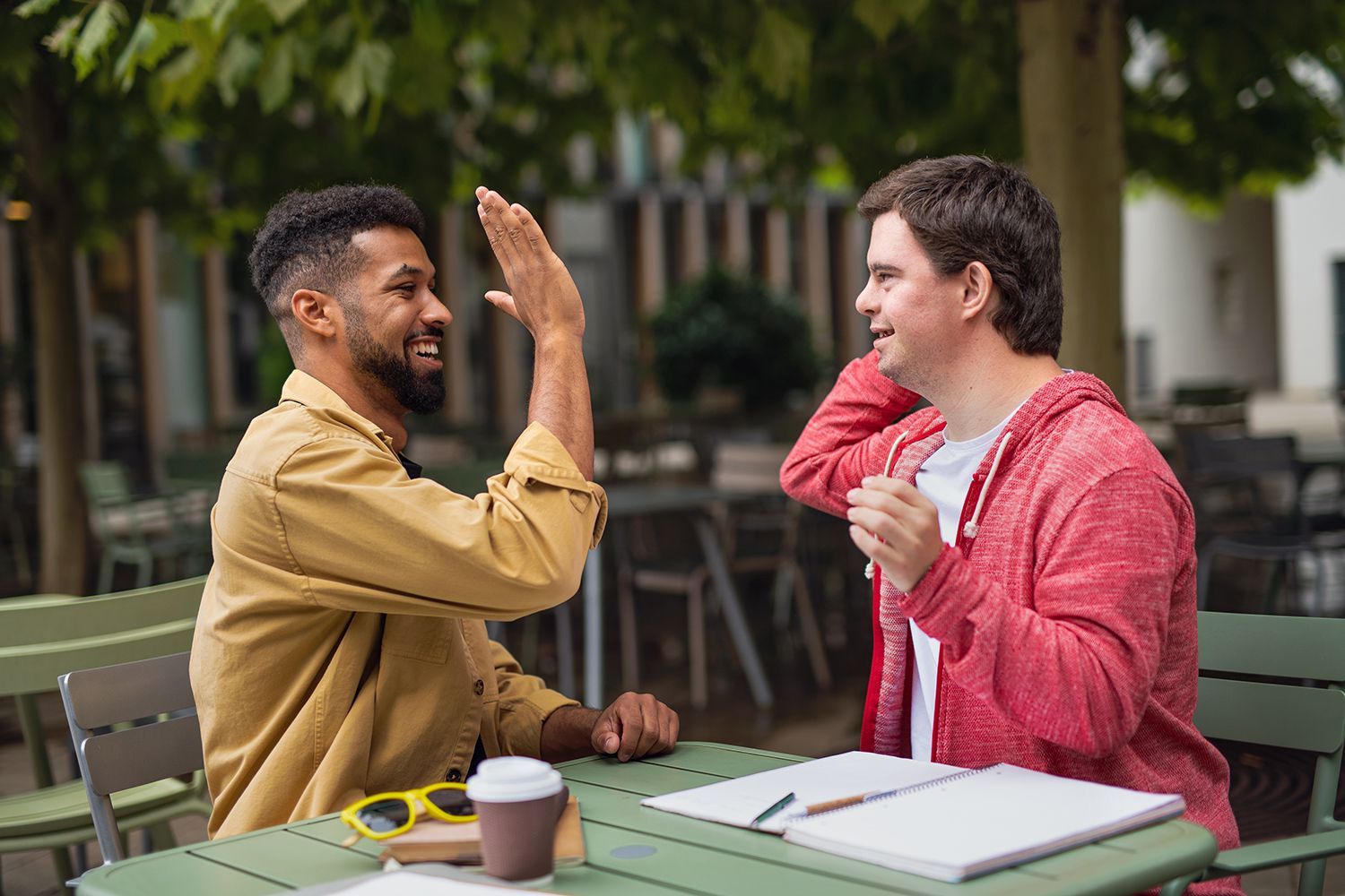 two people giving a high five
