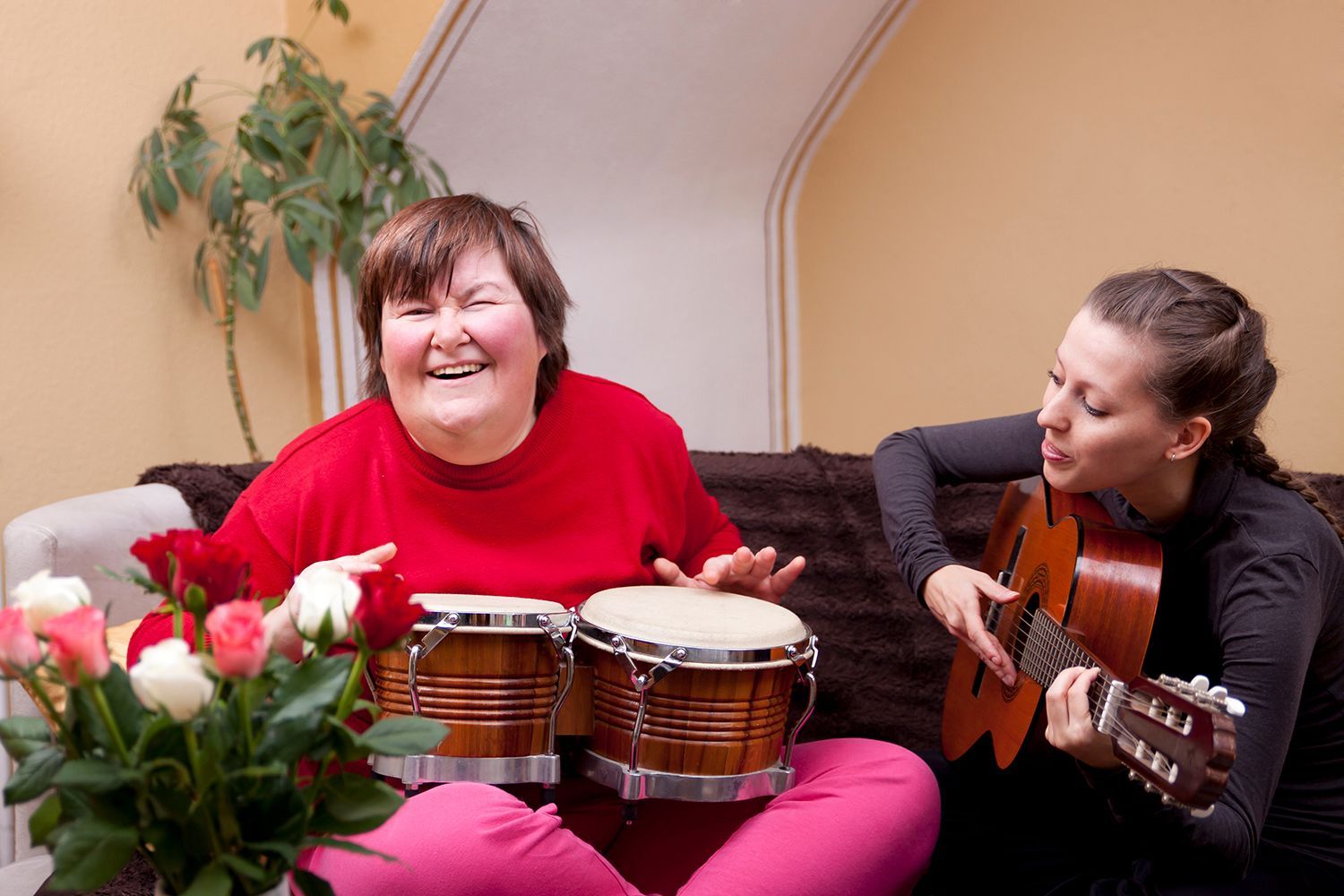 two women playing guitar and drums