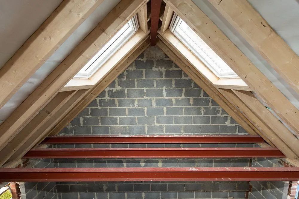 Roof apex with skylight windows and steel support beams