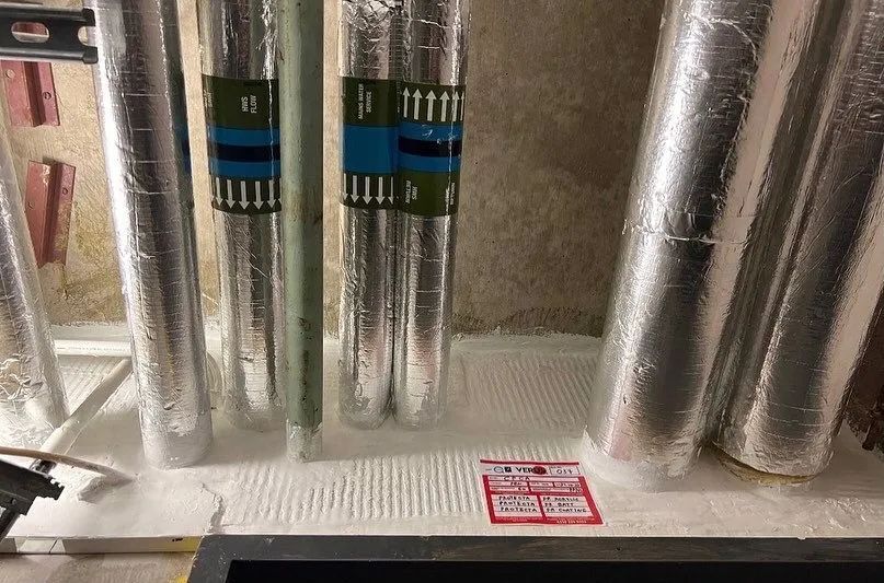 Verus Group fire-rated seal around foil-wrapped pipes