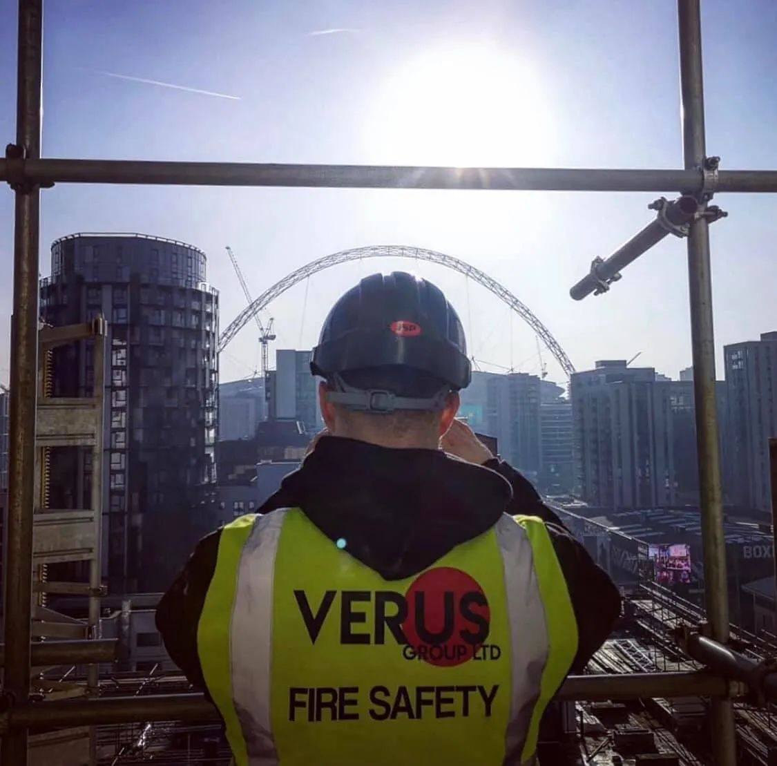 Verus Group fire safety worker on scaffolding overlooking the London skyline