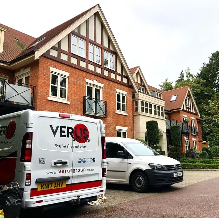 Verus Group vans parked outside a period property