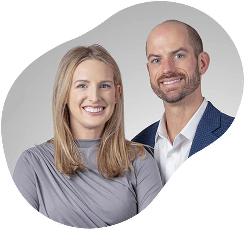 Two smiling business professionals posing against a light gray circular background