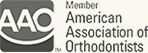 American Association of Orthodontists logo in gray and black with stylized “AAO” letters