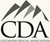 Colorado Dental Association logo with stylized gray mountains above the letters CDA