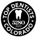 Black-and-white circular “Top Dentists Colorado” award badge with a tooth icon and “5280 2022” text
