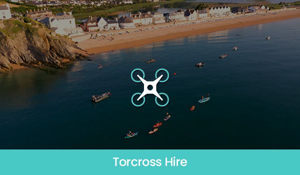 Aerial view of Torcross beach with boats and kayaks. Drone icon overlayed.