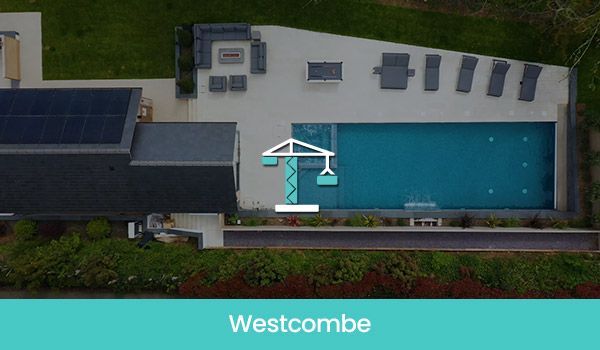 Aerial view of a home with a pool, patio, and solar panels. 