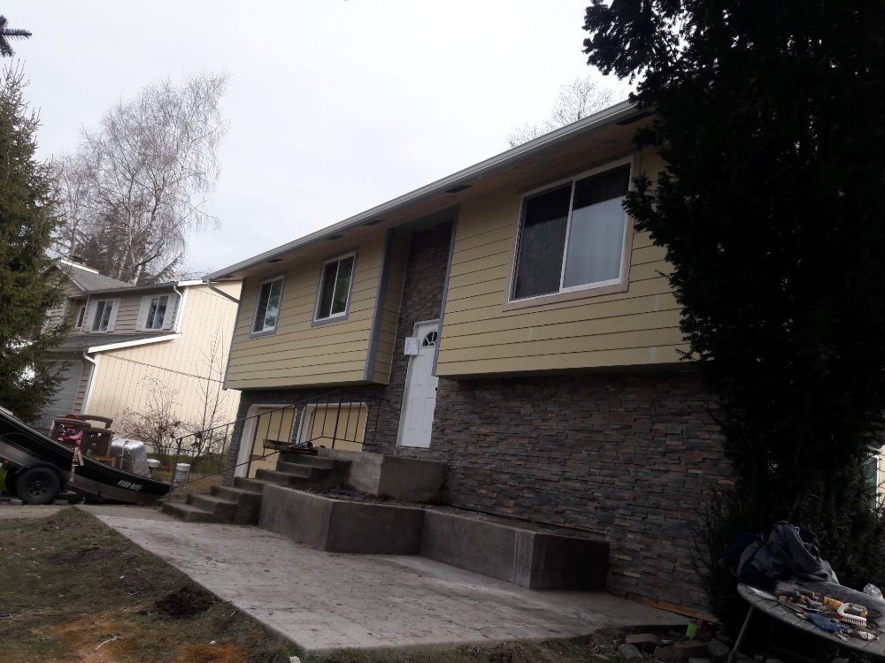 A house with a lot of windows and stairs