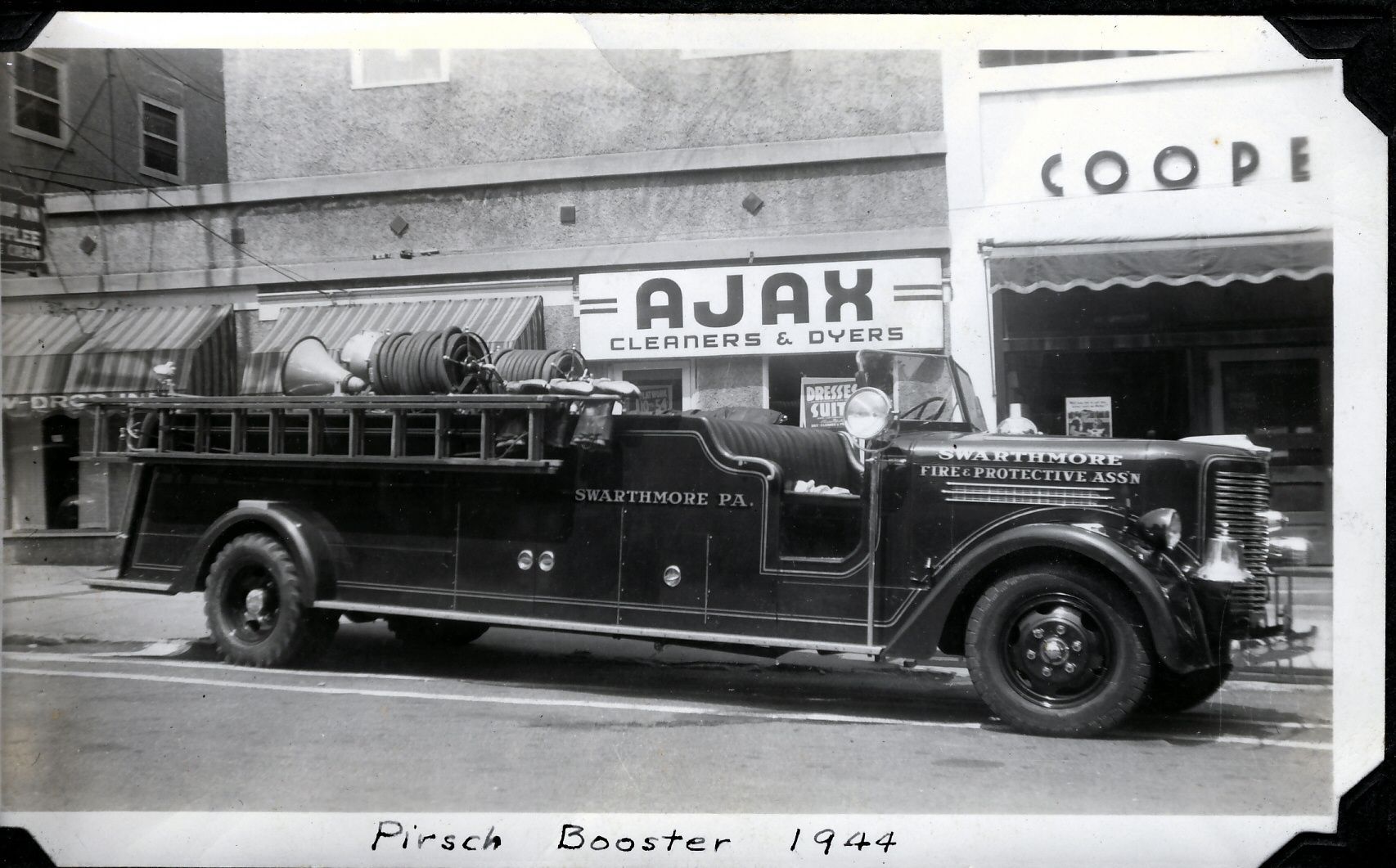The Pirsch booster in front of Ajax Cleaners, 1944.