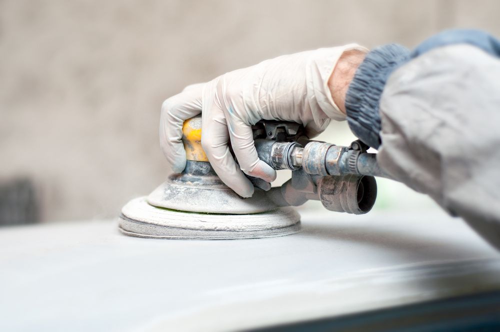 Auto Mechanic Polishing The Car For Painting — Panel Beaters in Mitchell, ACT