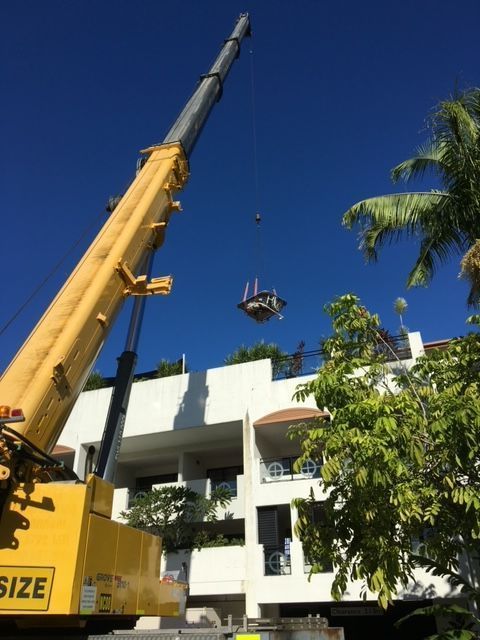 A Yellow Crane With the Word Size on It — Kelly's Crane Hire in Mossman, QLD
