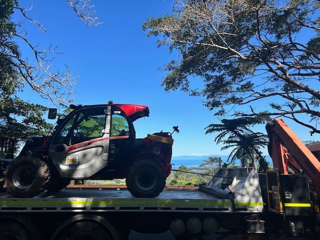Tilt Tray with Manitou In The Daintree Forest - Kelly's Crane Hire in Mossman, QLD