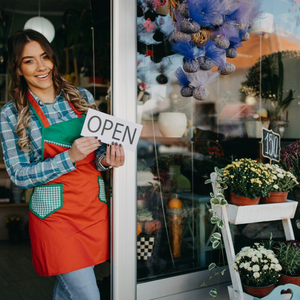 Woman in apron holds