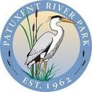 Patuxent River Park logo with a white bird, reeds, and blue circular text, “Est. 1962”