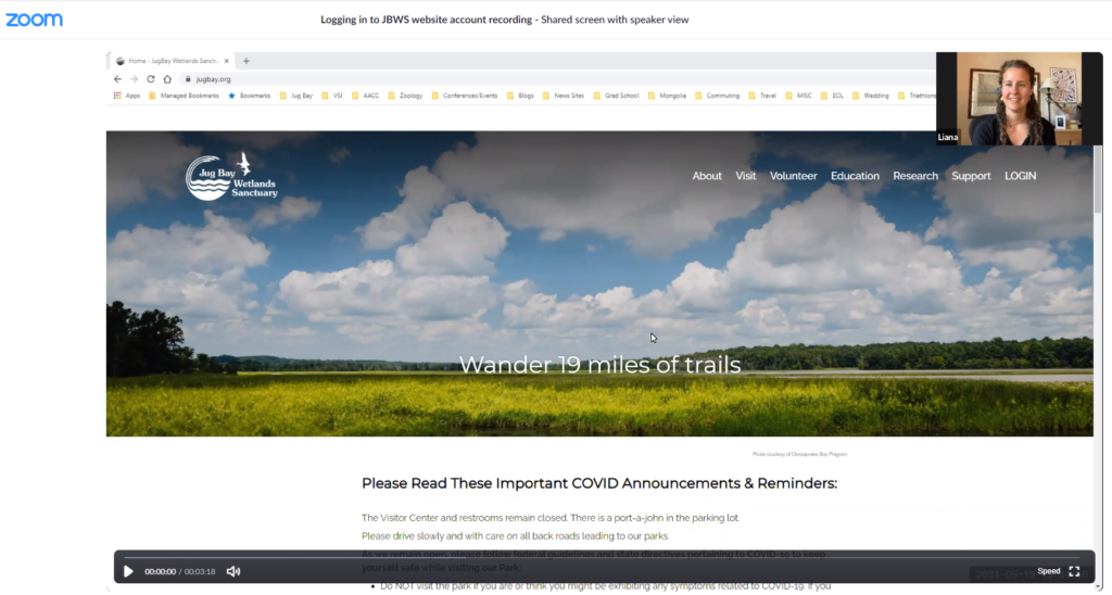 Website homepage with a wide landscape banner under a blue sky and a small Zoom video window in the top right