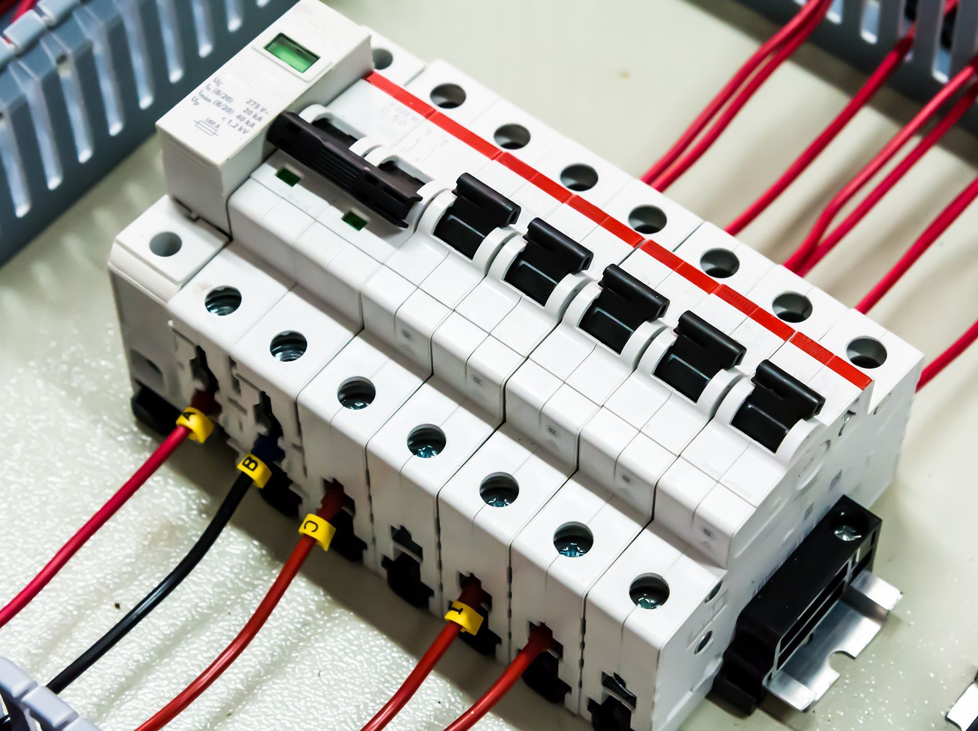 A bunch of wires are connected to a circuit breaker