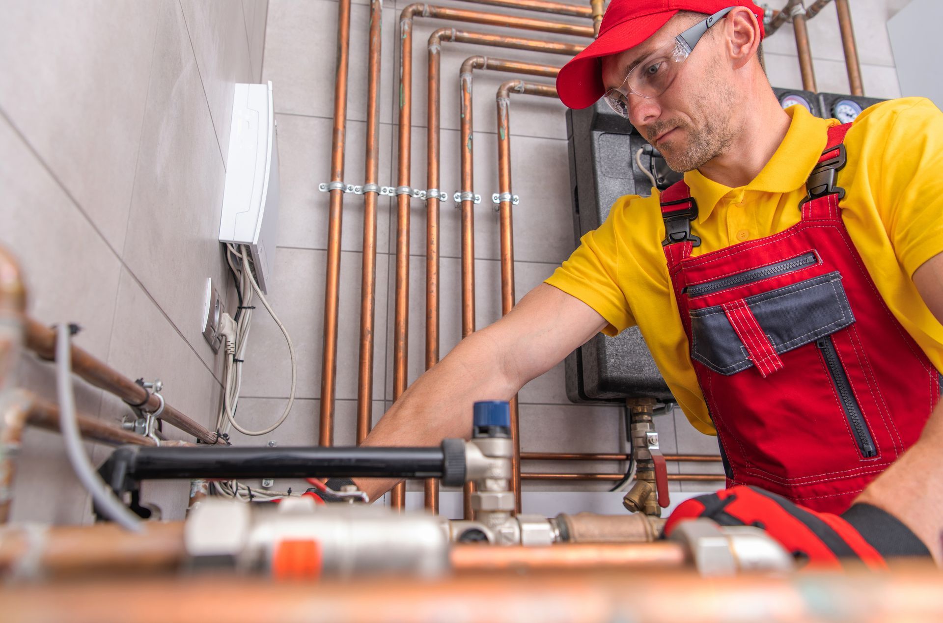 Hand cleaning an outdoor air conditioner unit with a spray bottle