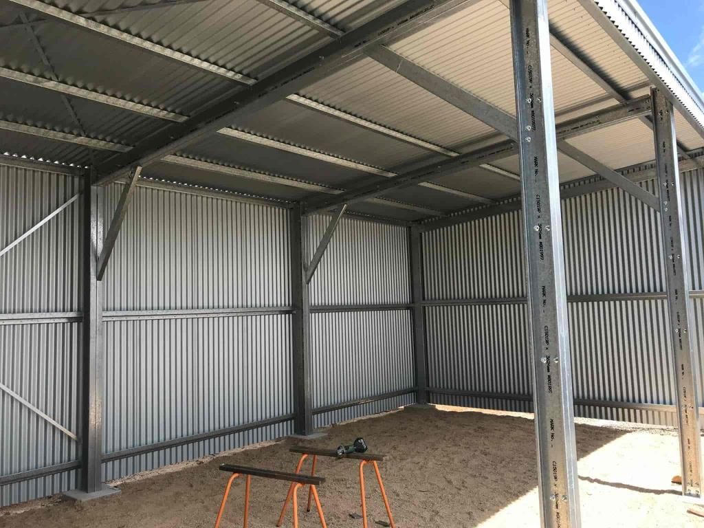 A Metal Structure With A Roof And A Table In The Middle Of It — Just Sheds In Kunda Park, QLD