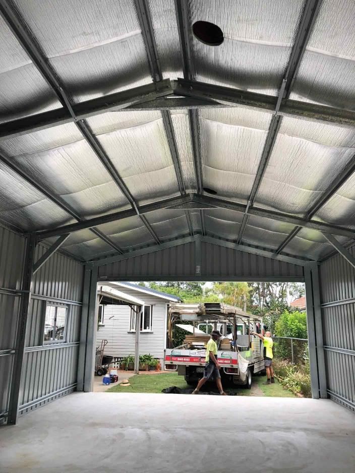 A Truck Is Parked In A Garage With A Ceiling Fan — Just Sheds In Kunda Park, QLD
