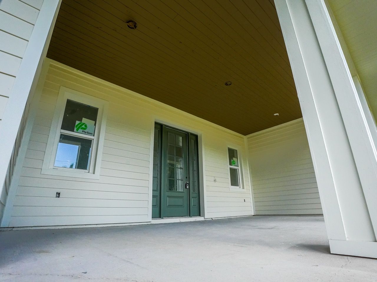 Covered front porch and entryway detail of the 1122 Dingens Ave custom home project by BittnerSweet Co
