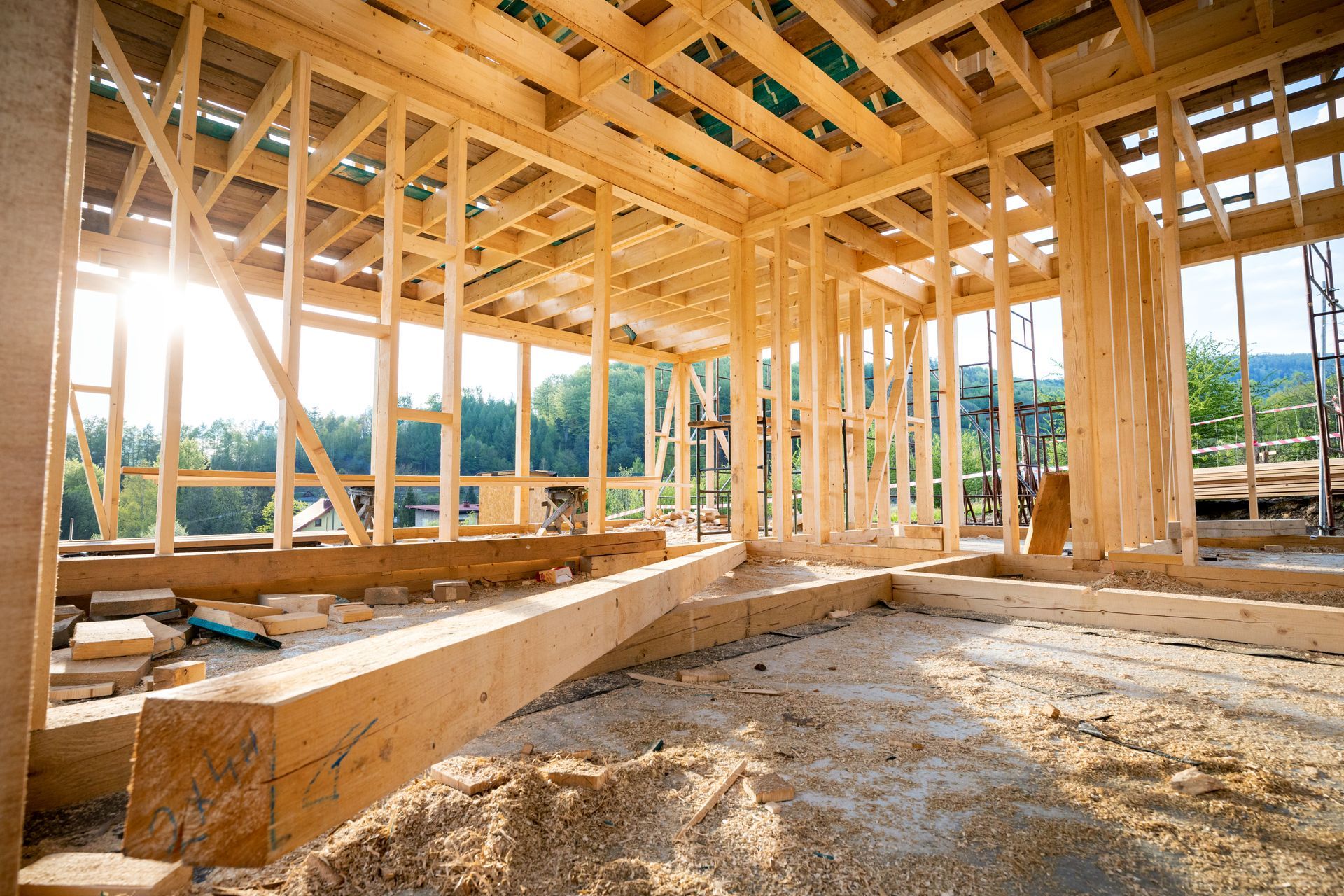 New home construction framing phase showing wooden frame structure and foundation in Winter Park FL