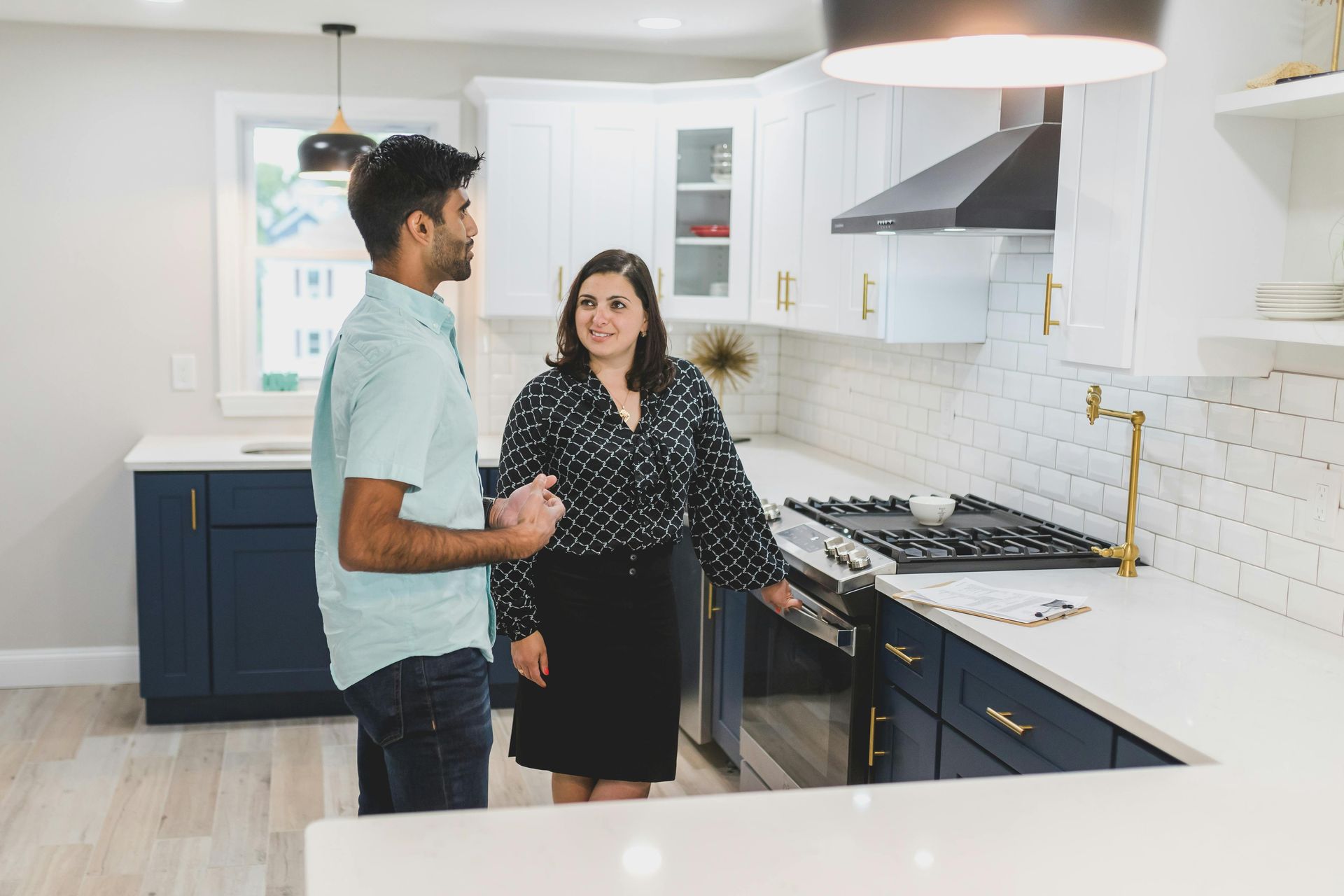 A contractor and homeowner are planning a kitchen remodeling