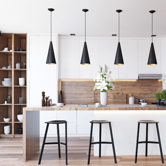 A Kitchen With Stools And A Table With A Vase Of Flowers On It — Howells & Co Legal & Conveyancing In Cessnock, NSW