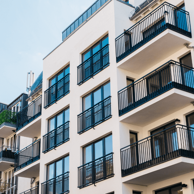 A Large Apartment Building With Many Balconies And Windows  — Howells & Co Legal & Conveyancing In Cessnock, NSW
